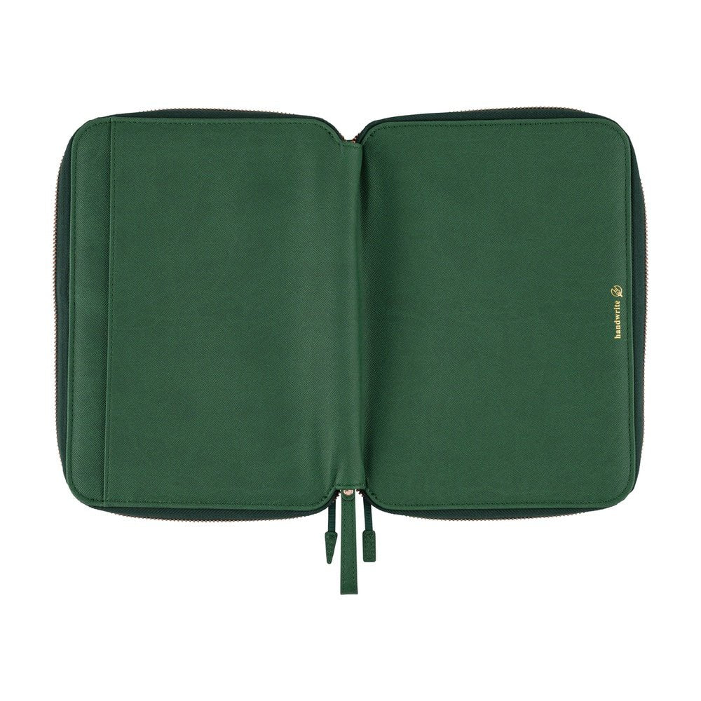 A flat view of the deep green Hobonichi Techo zippered outside cover with a textured finish, gold-colored hardware, wrist loop, and gold handwrite logo on a plain white background.