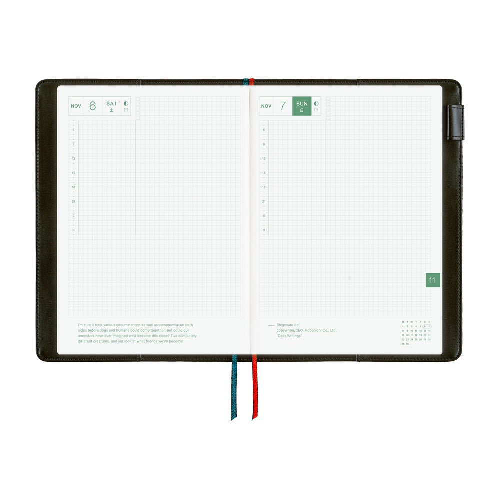 An open weekly planner featuring white grid pages, and colored ribbon bookmarks in red and blue, shown on a plain white background.