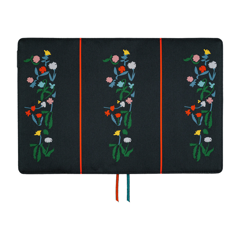 A navy fabric planner cover showing three vertical panels, each decorated with a colorful embroidered floral motif. Thin red and blue ribbon bookmarks hang from the bottom against a plain white background.