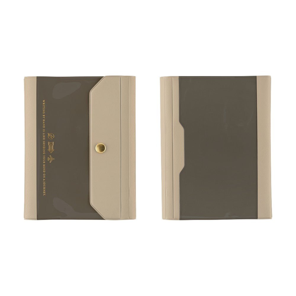 Two slim A6 notebook covers shown side by side on a plain white background. Each has a dark taupe-brown front panel with a beige side border and a small gold snap/button detail on the left item.