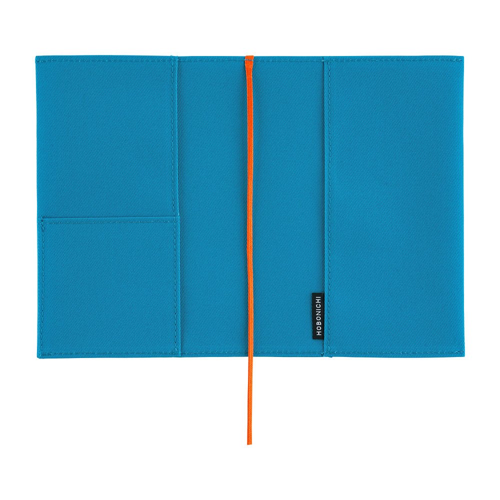 A bright blue notebook cover with a vertical orange bookmark and a small black brand tag reading 'Hobonichi' on the right side, shown flat against a white background.