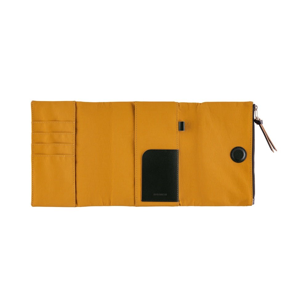 Yellow fabric notebook cover open with card slots and black pocket against white background