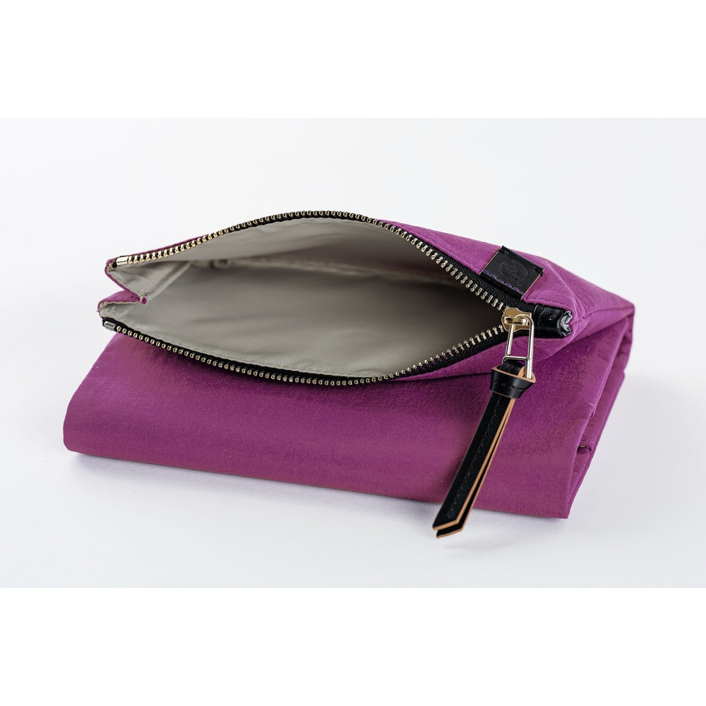 A folded purple fabric pouch with an open zipper showing a light gray interior, photographed on a clean white background.