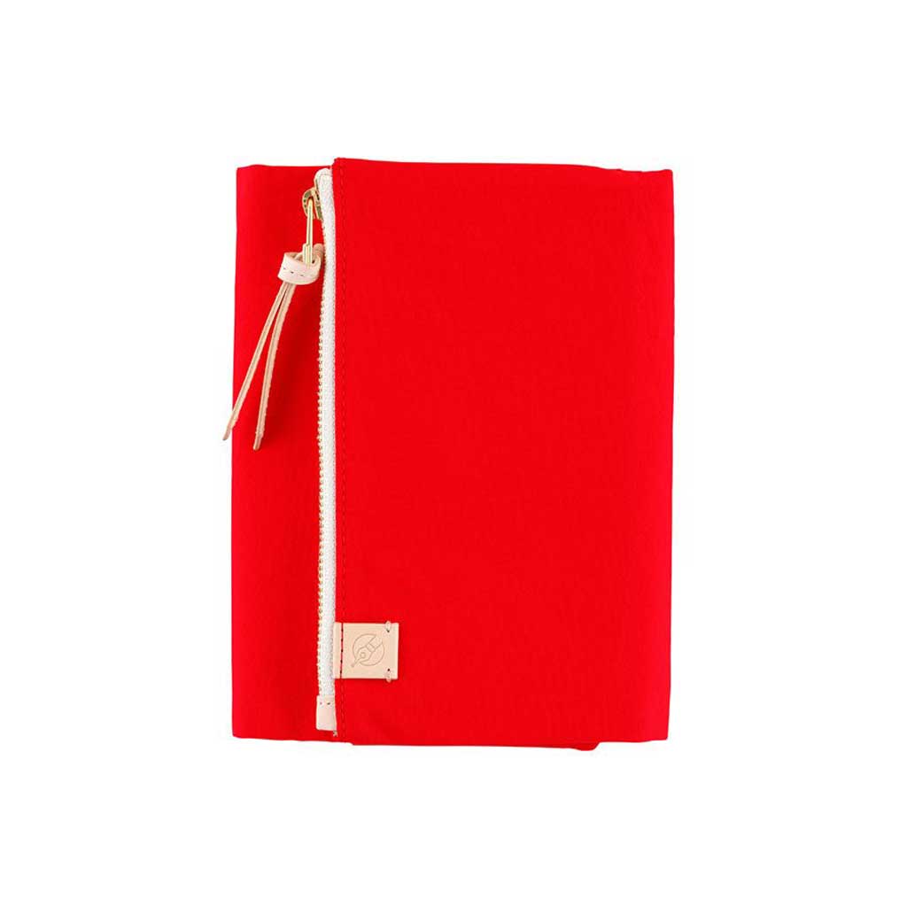 Red zippered Tragen cover for Hobonichi Techo A6 planner on white background