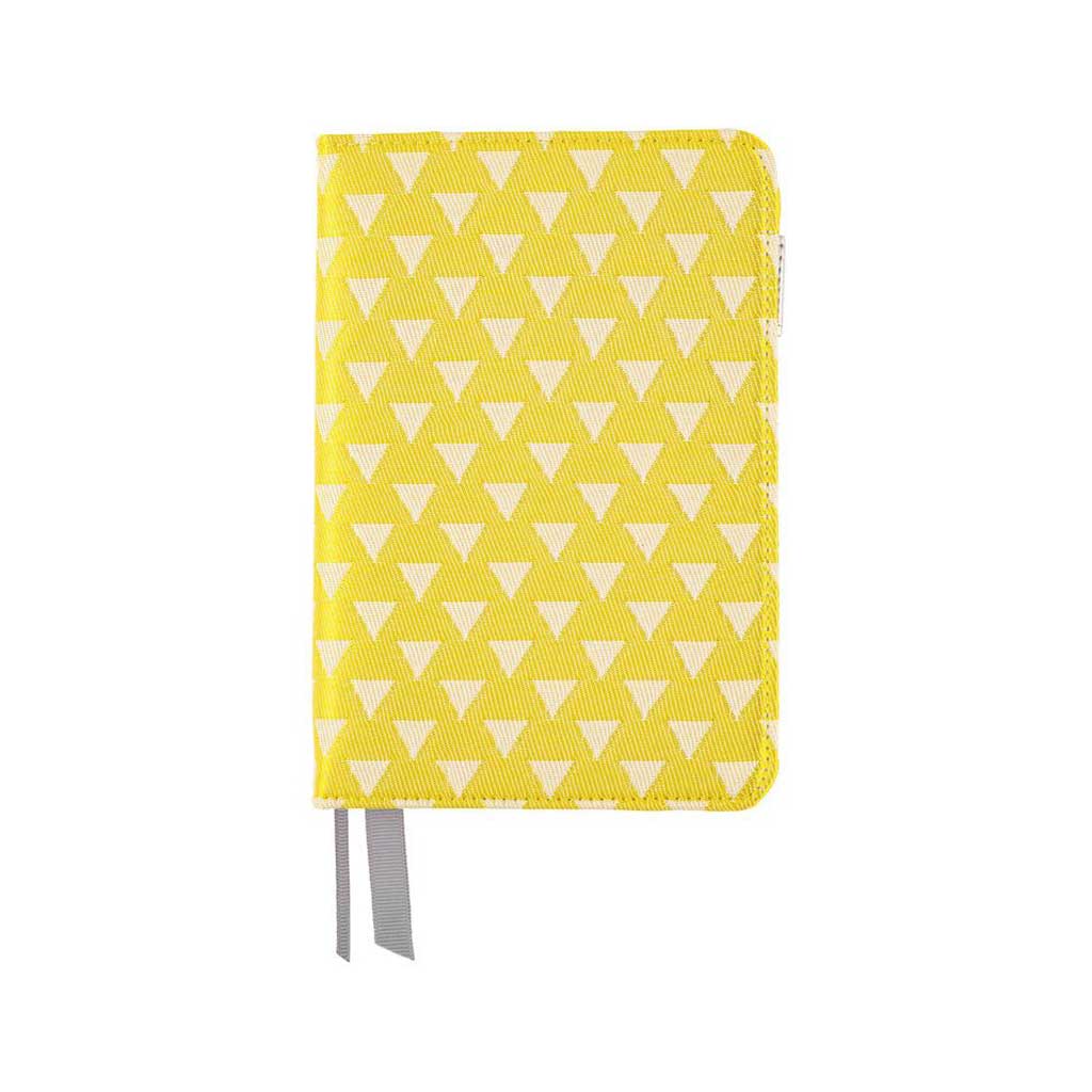Yellow fabric notebook cover with white triangle pattern for Hobonichi Techo A6 planner on white background