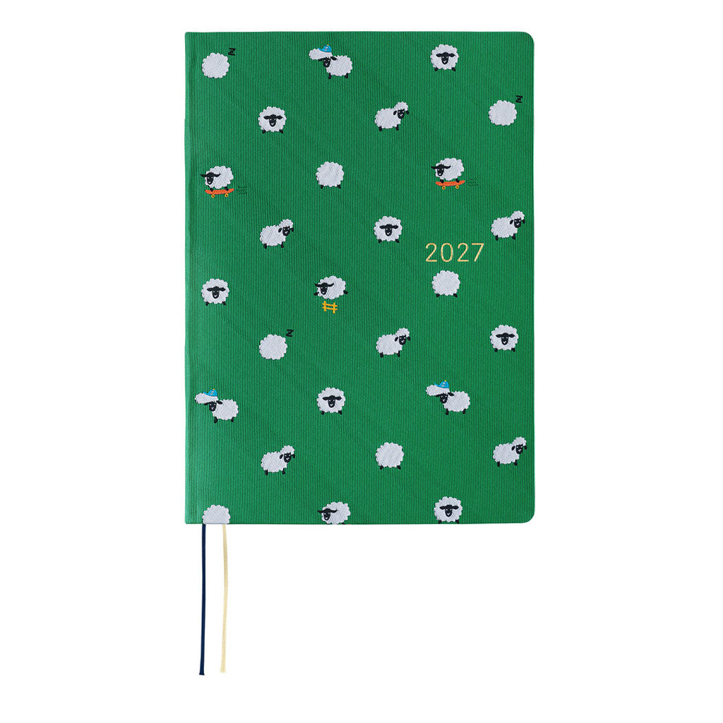A green 2027 Hobonichi Techo HON hardcover planner featuring a repeating pattern of playful white sheep, some sleeping, skateboarding, or wearing hats, with two ribbon bookmarks on a white background.