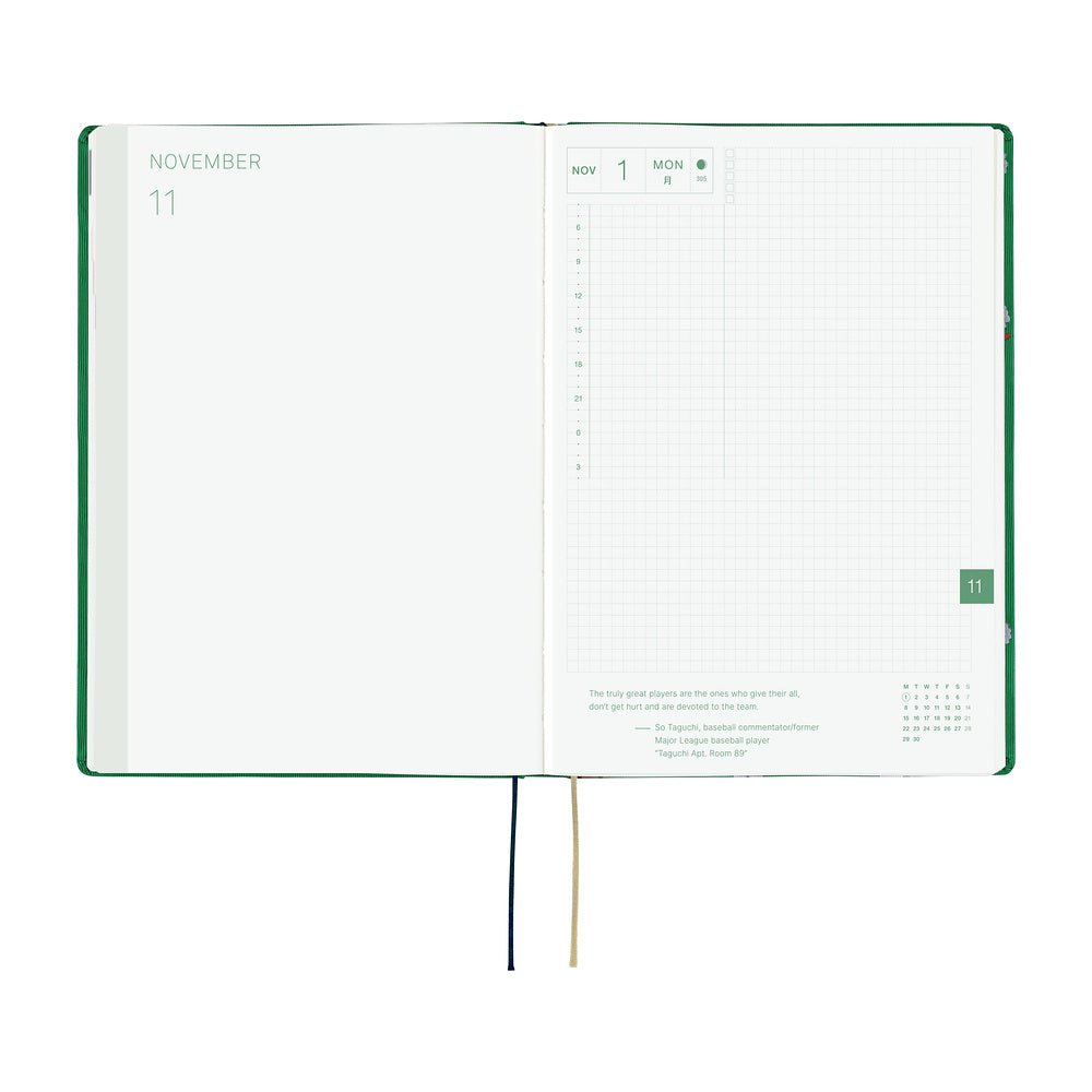 An open 2027 Hobonichi Techo HON hardcover planner showing the November start page beside a daily grid page, with two ribbon bookmarks hanging below on a white background.