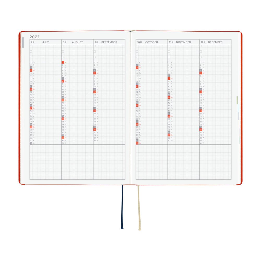 An open 2027 Hobonichi Techo HON hardcover planner showing a six-month overview from July through December, with two ribbon bookmarks on a white background.
