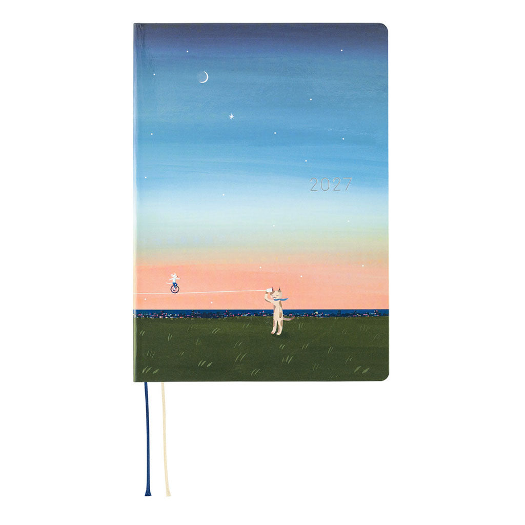 A 2027 Hobonichi Techo HON hardcover planner featuring Hiroko Kubota’s illustration of a cat and wolf using a string telephone across a grassy meadow at sunset, with a mouse riding a unicycle along the line beneath a starry sky and crescent moon.