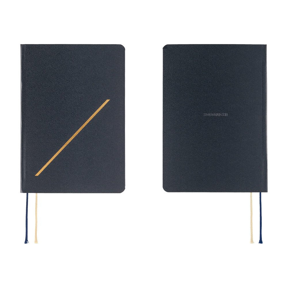 Front and back views of the dark navy 2027 Hobonichi Techo HON hardcover, with a gold-embossed slash on the front and two ribbon bookmarks on a white background.