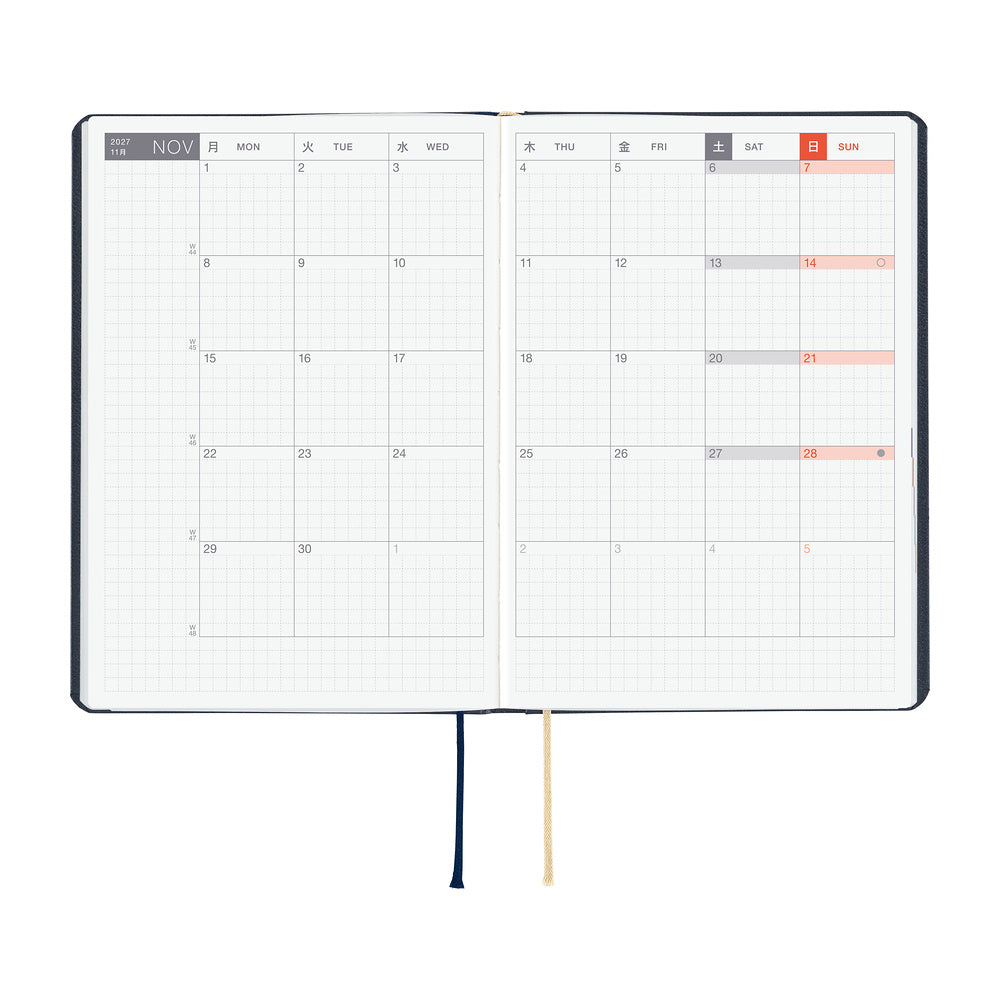 An open 2027 Hobonichi Techo HON hardcover planner showing a two-page monthly calendar layout for November, with two ribbon bookmarks hanging below on a white background.