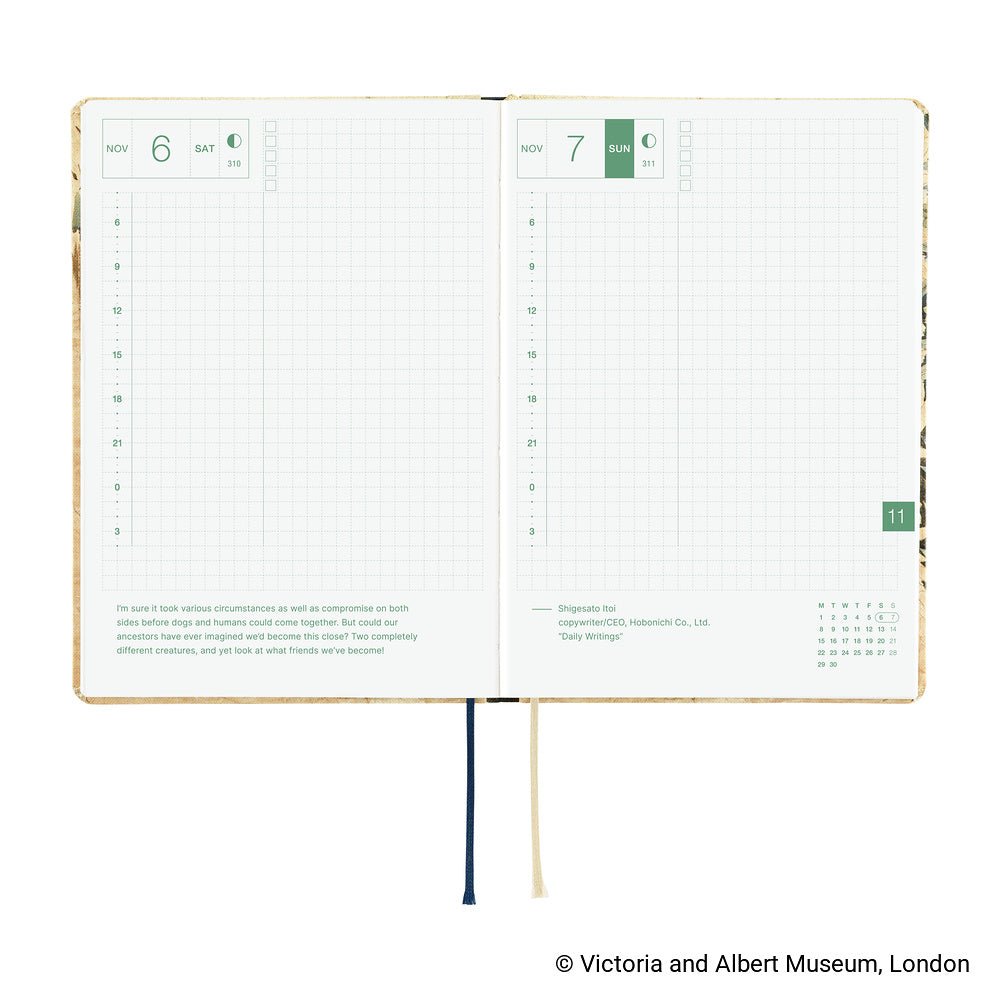 An open 2027 Hobonichi Techo HON hardcover planner showing two daily grid pages for November 6 and 7, with timelines, checkboxes, quotes, and two ribbon bookmarks on a white background.