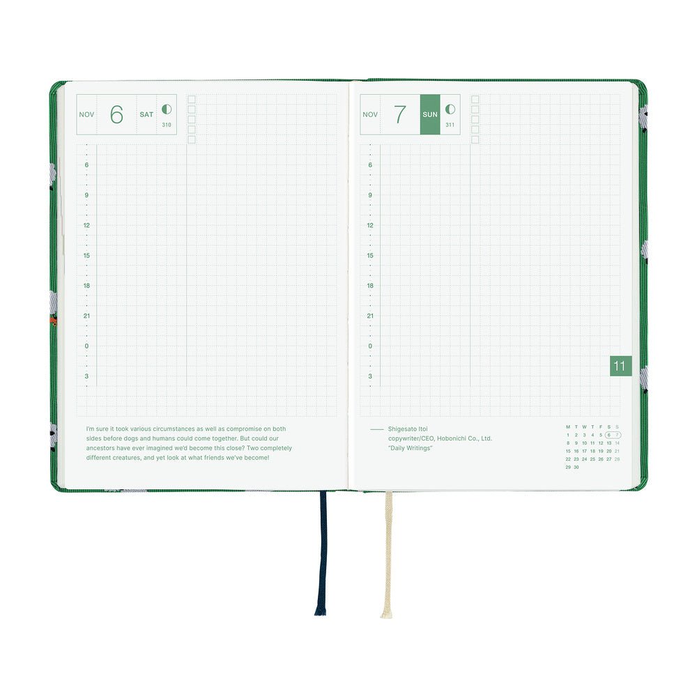 A 2027 Hobonichi HON covered in Bow & Tie fabric woven with a sheep design on a green background