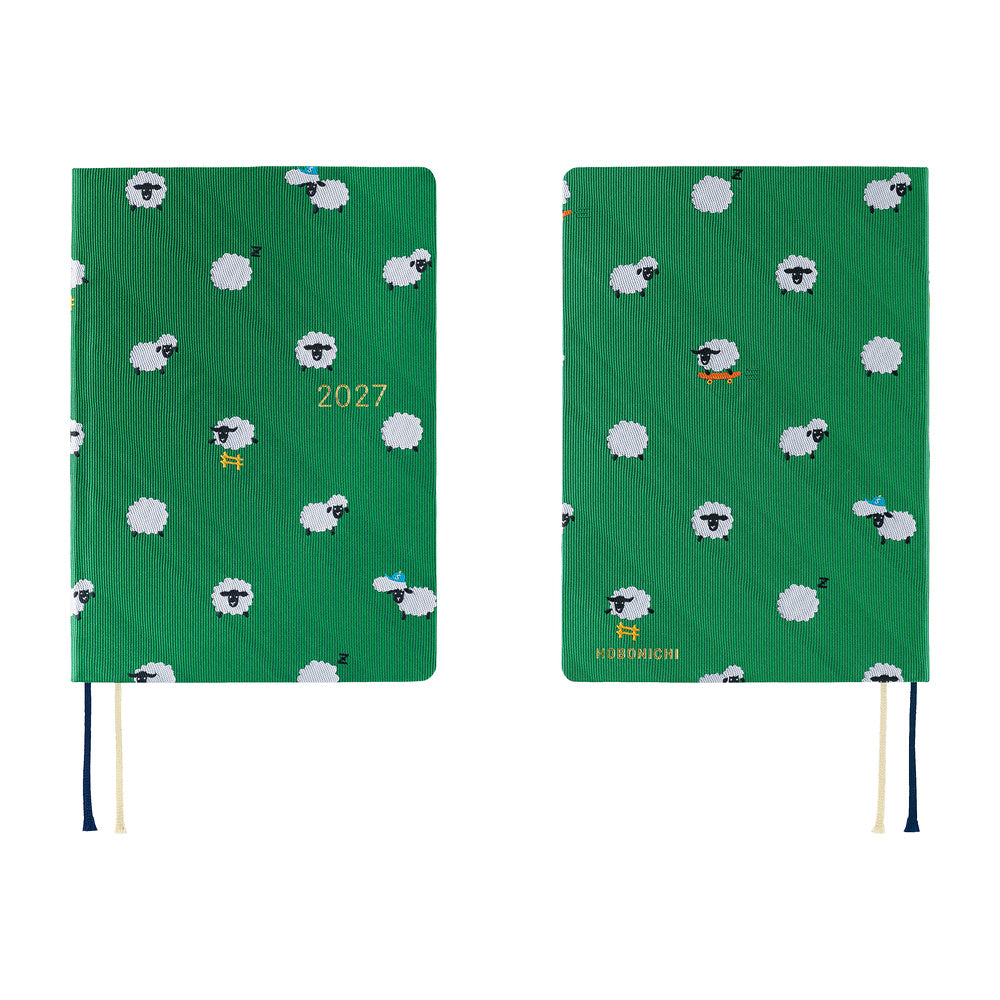 A 2027 Hobonichi HON covered in Bow & Tie fabric woven with a sheep design on a green background