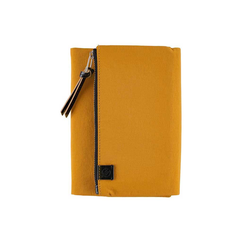 Mustard yellow zippered Tragen case for Hobonichi Techo A6 planner on white background