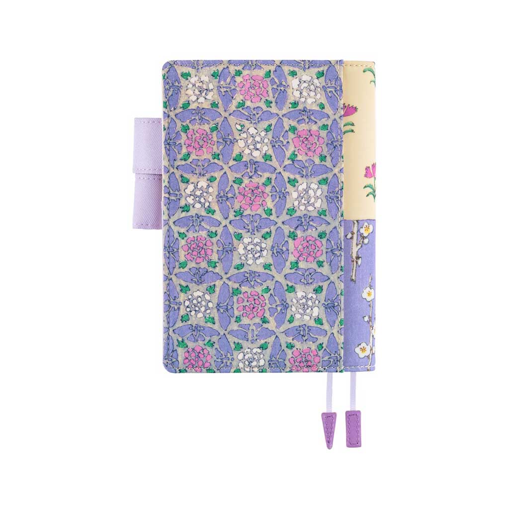 Back of Hobonichi Techo A6 Original Unsodo Book in ivory and purple floral cover with purple pen loops on white background