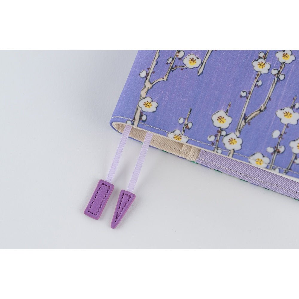 Close up of purple page keeper bookmarks of Hobonichi A6 cover