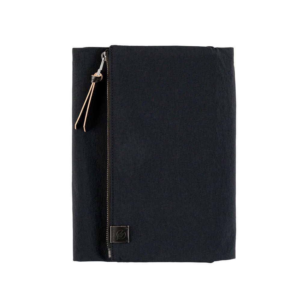 Black fabric Tragen zippered cover for Hobonichi Techo Cousin A5 planner on white background