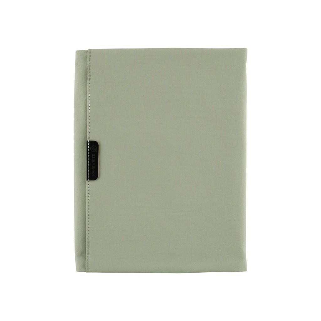 Oakmoss green fabric Tragen zippered cover for Hobonichi Techo Cousin A5 planner on white background