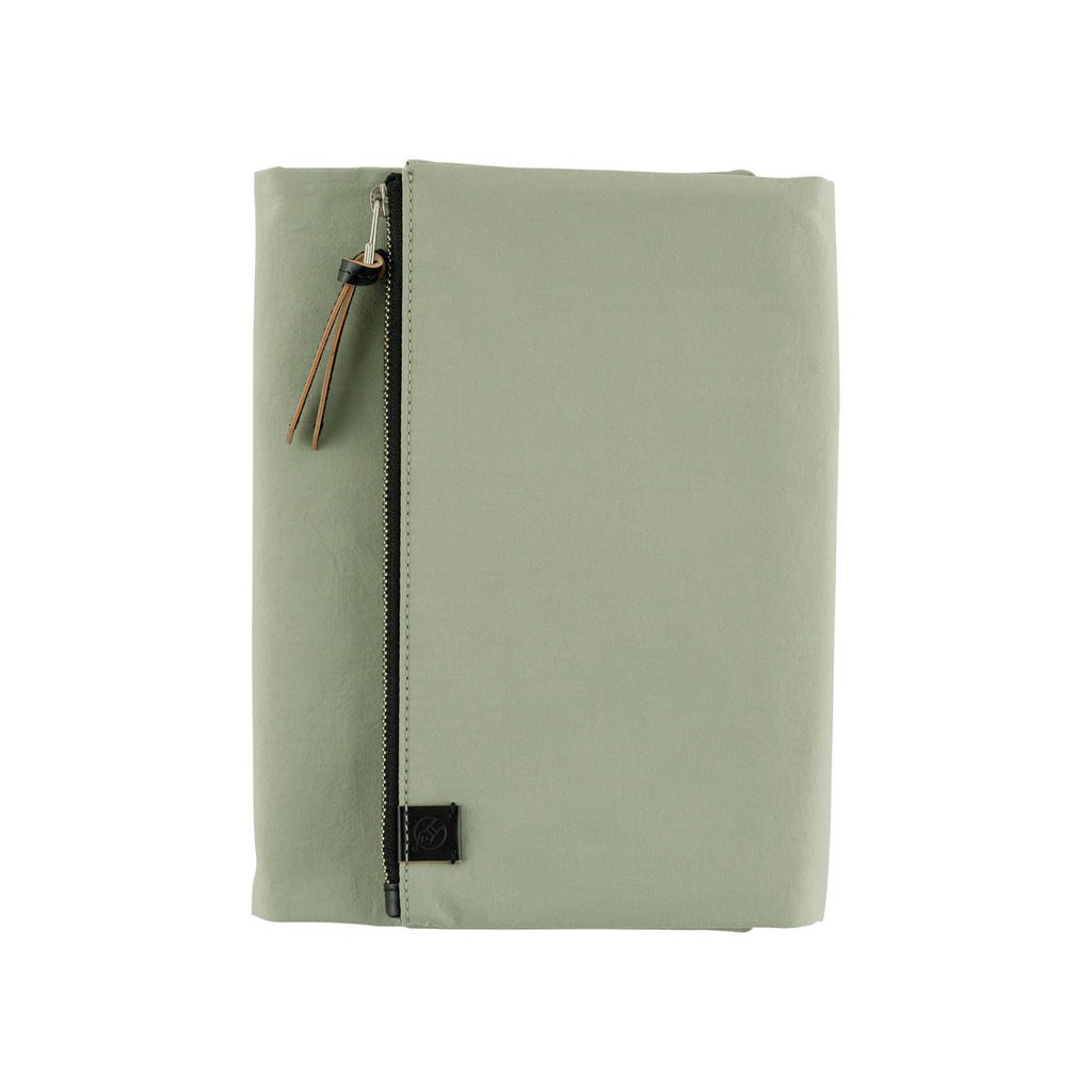 Oakmoss green fabric Tragen zippered cover for Hobonichi Techo Cousin A5 planner on white background