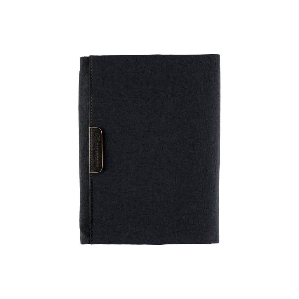 Black zippered Tragen cover for Hobonichi Techo A6 planner on white background