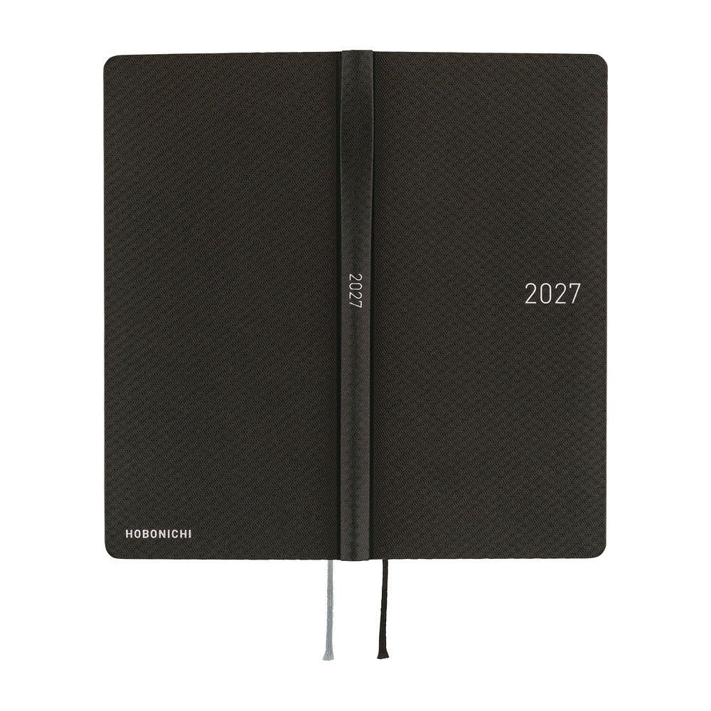 The exterior of a slim 2027 planner with a patterned black cover, featuring a silver-embossed '2027'.