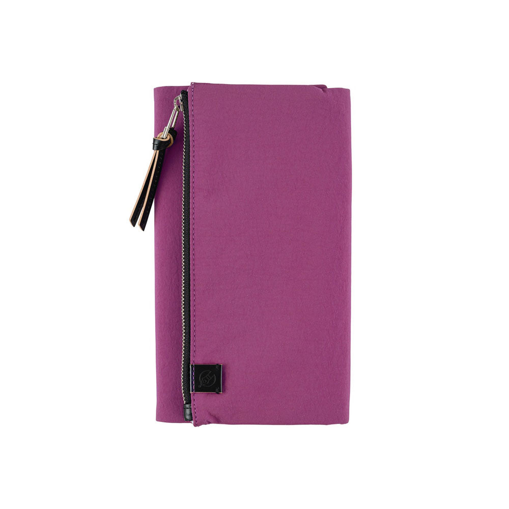 A Hobonichi Weeks Tragen cover in the color Purple.