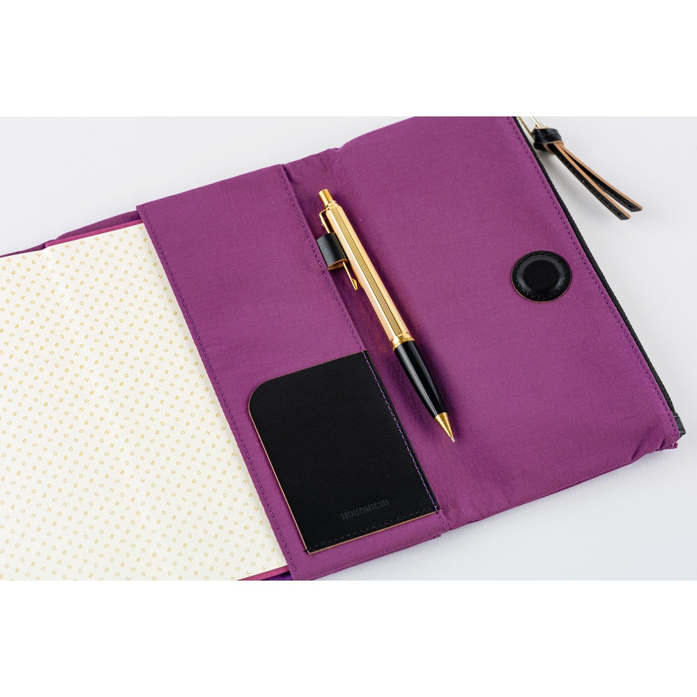 A Hobonichi Weeks Tragen cover in the color Purple.