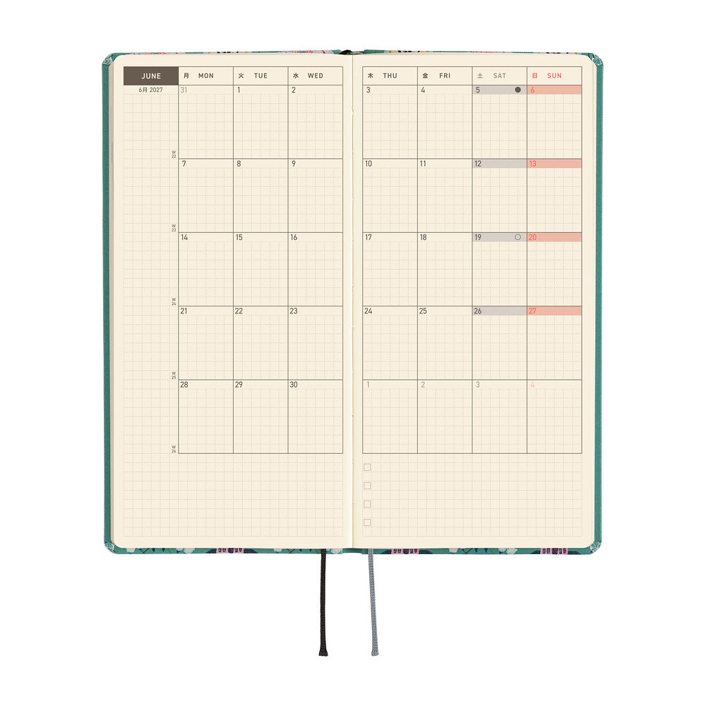 An open planner or journal with a grid calendar layout showing June, on a white background.