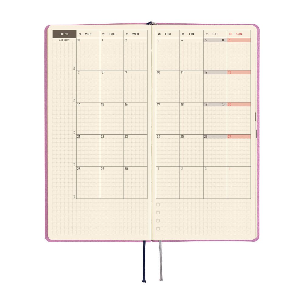 An planner showing a monthly calendar layout on warm cream pages.