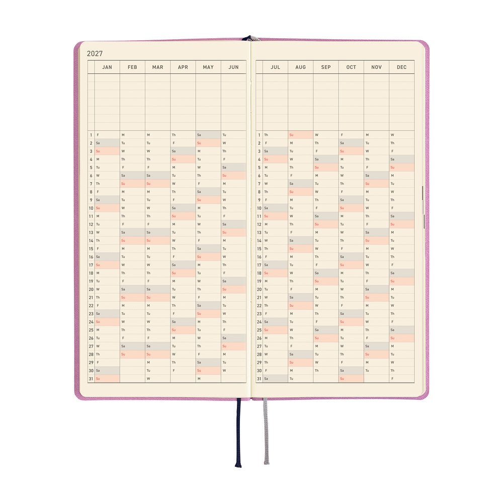 An open monthly planner or calendar with cream-colored pages and a vertical grid layout showing dates from January to December. Black and gray ribbon bookmarks hang from the bottom center.