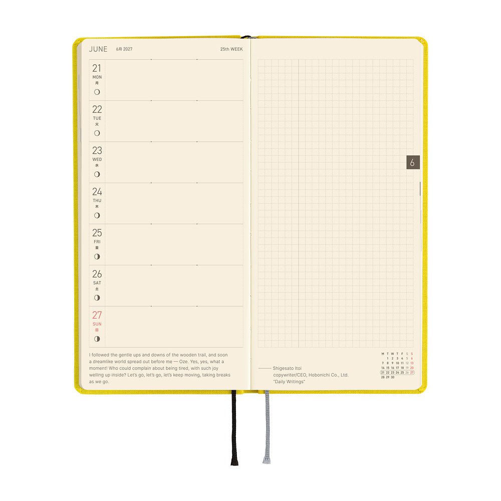 An open weekly planner spread showing a Monday through Sunday layout on the left page and a grid ruled page on the right.