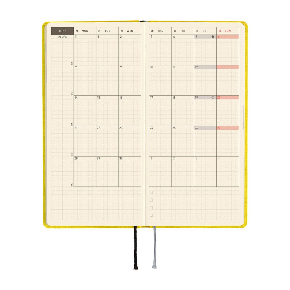 A planner open to a two-page monthly spread showing the month of June.