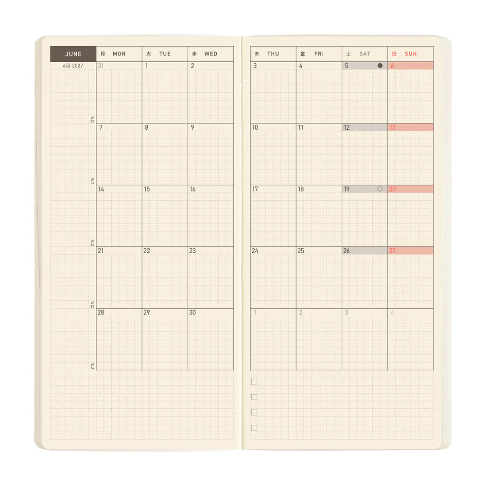 An open monthly planner spread with cream-colored grid pages showing the month of June.