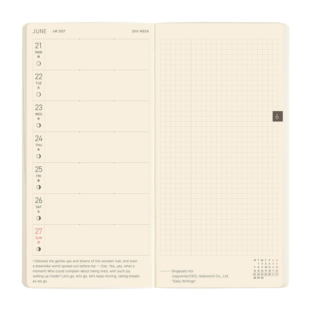 An open cream-colored daily planner showing a weekly layout on the left page and a blank grid section on the right page, photographed against a plain white background.
