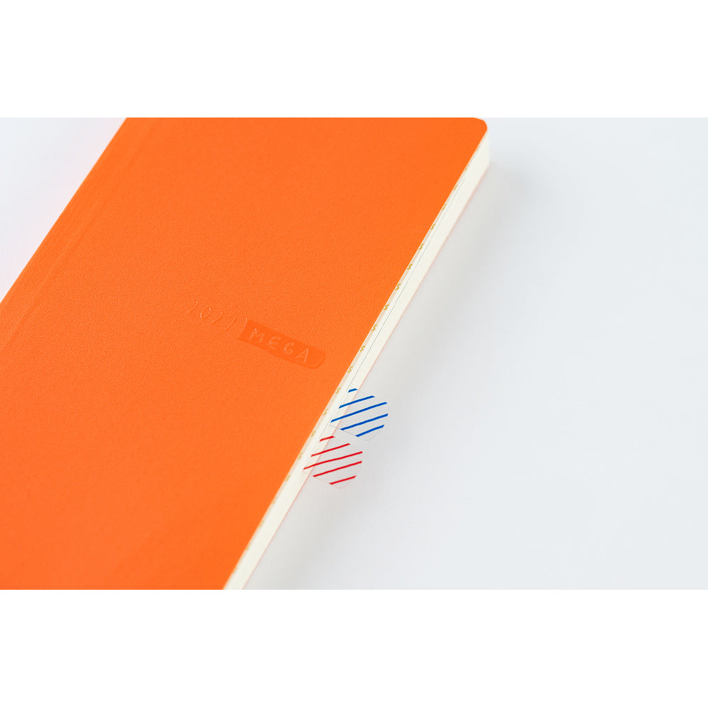 A close up of a bright orange planner showing an example of how adhesive tabs can be used to tag pages.