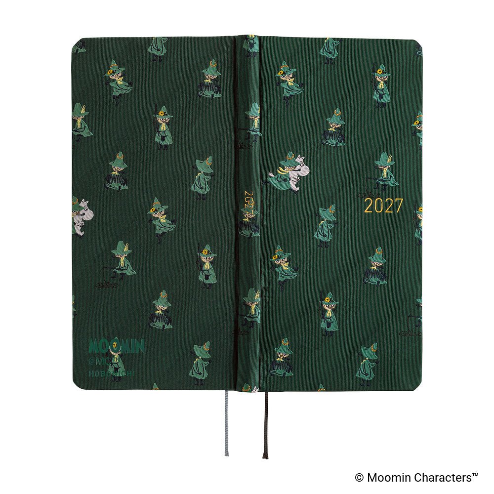 The exterior of a dark green planner covered with woven "bow & tie" fabric featuring Moomin characters and the year '2027' in gold foil.