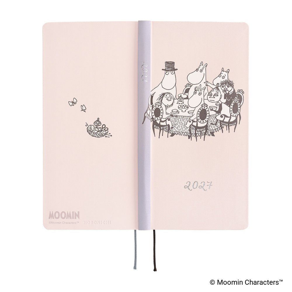 A pale pink Moomin 2027 daily planner shown open, featuring black line-art illustrations of Moomin characters.