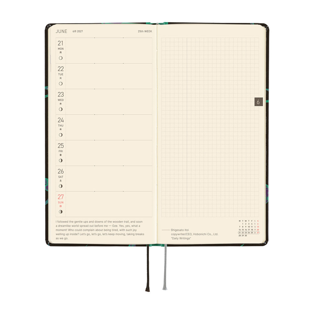 An open planner showing a two-page spread: the left page has a weekly schedule layout for June 21-27 with small time slots and a short quote, and the right page has a grid for writing.