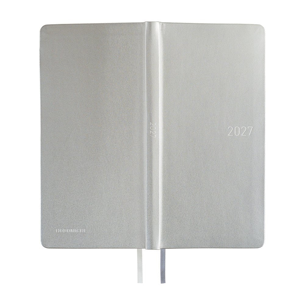 The exterior of a slim planner covered in silver leather. 2027 is embossed in silver on the front cover and spine.