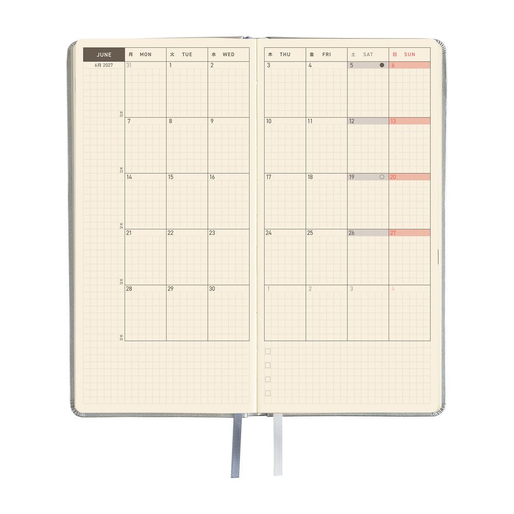 An open planner showing a two-page monthly calendar spread.
