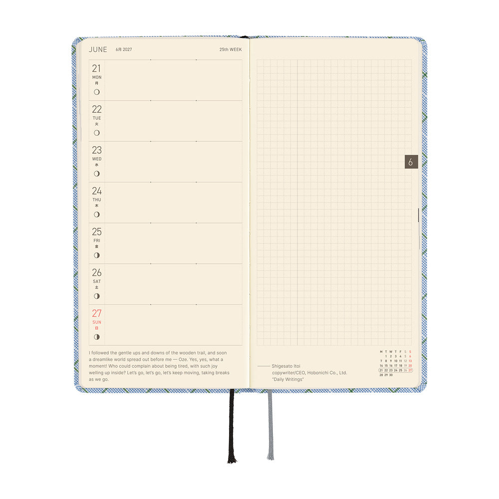 An open weekly planner spread with cream-colored pages. The left-side page has a weekly calendar, while the right page is a grid.