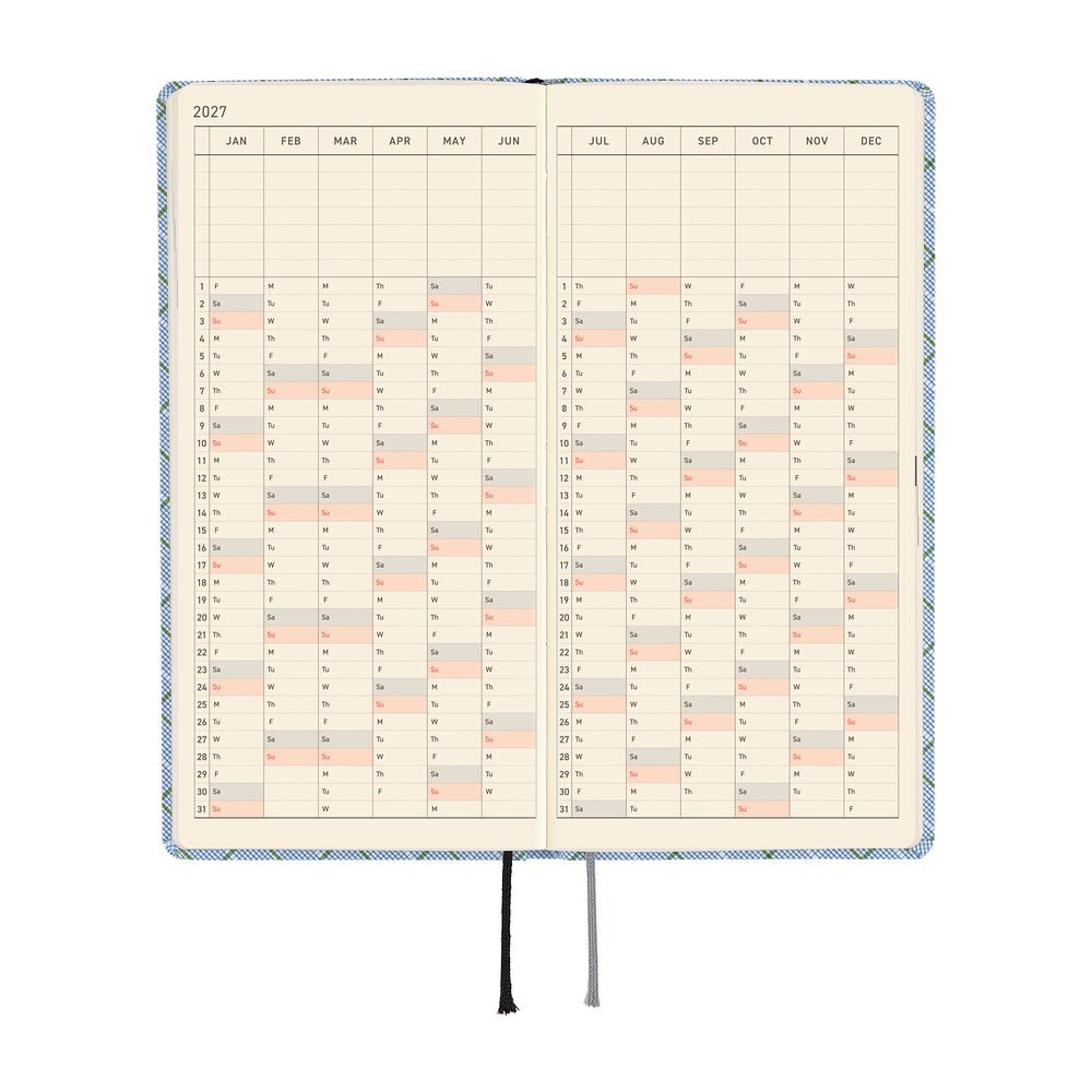 An open planner or calendar showing a 2027 yearly layout with cream pages.