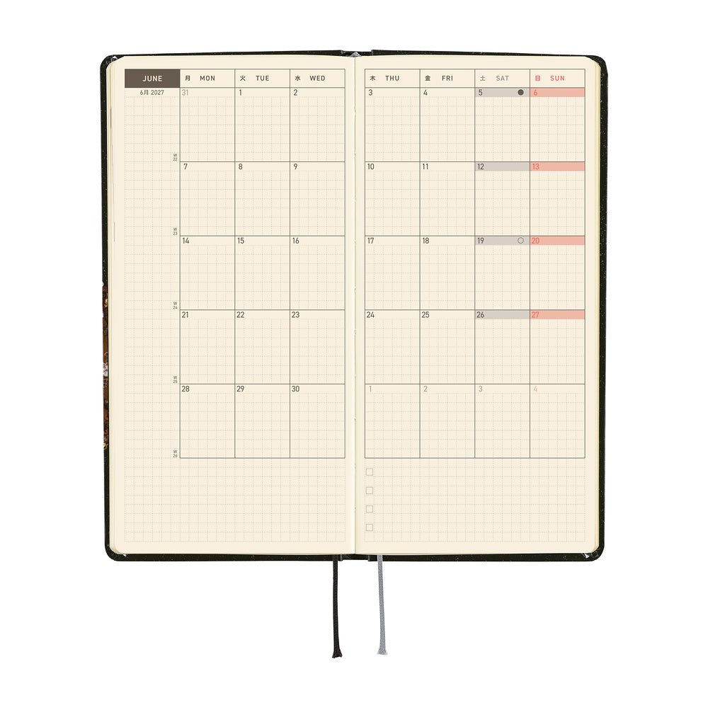 An open monthly planner with a two-page monthly calendar spread.