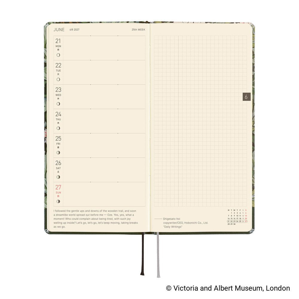 An open planner showing two interior pages: a weekly layout on the left with cream paper and a light grid page on the right.