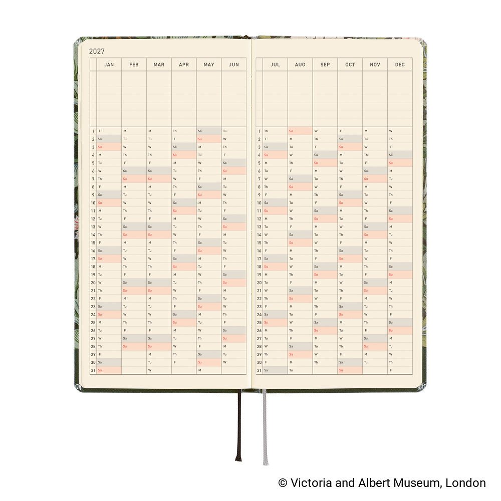 An open 2027 daily planner spread showing two printed calendar pages with a yearly grid, photographed on a white background.