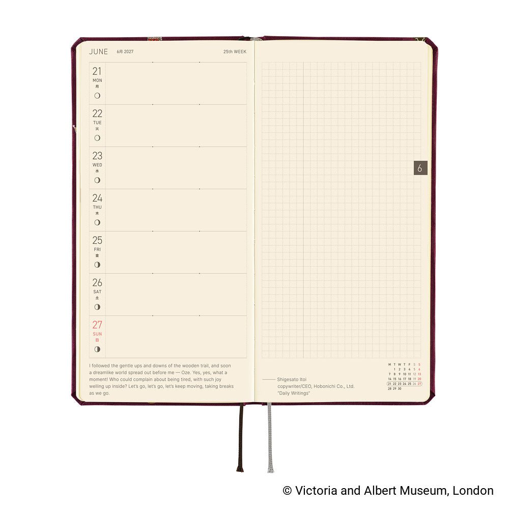 An open hardcover planner showing two interior spreads: the left page has a weekly schedule layout with dates from Monday to Sunday, and the right page has a light beige grid. The cover is dark red-brown, and the pages are cream.