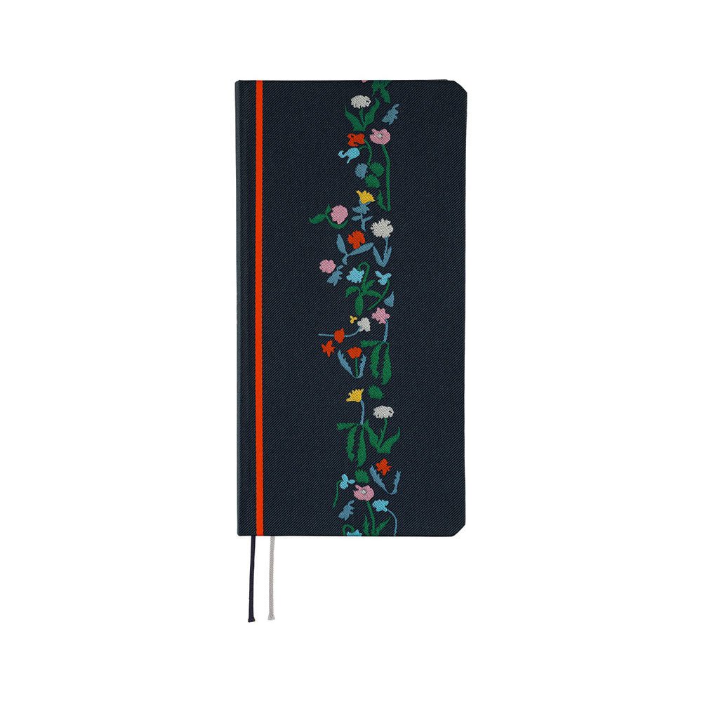 A dark navy blue planner with a vertical floral vine design in green, pink, blue, yellow, and white along the right side. It features a bright red band near the spine and ribbon bookmarks hanging from the bottom.