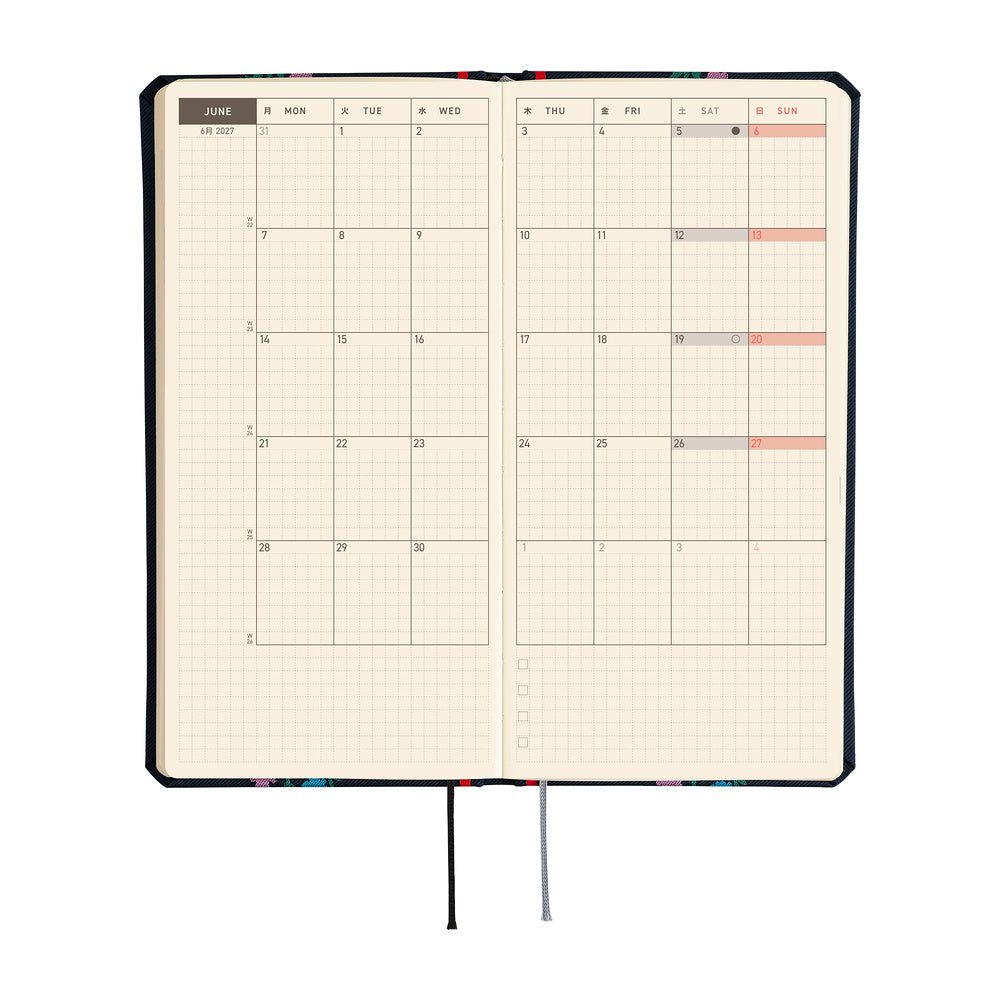 An open monthly planner on cream colored pages, shown on a plain white background.