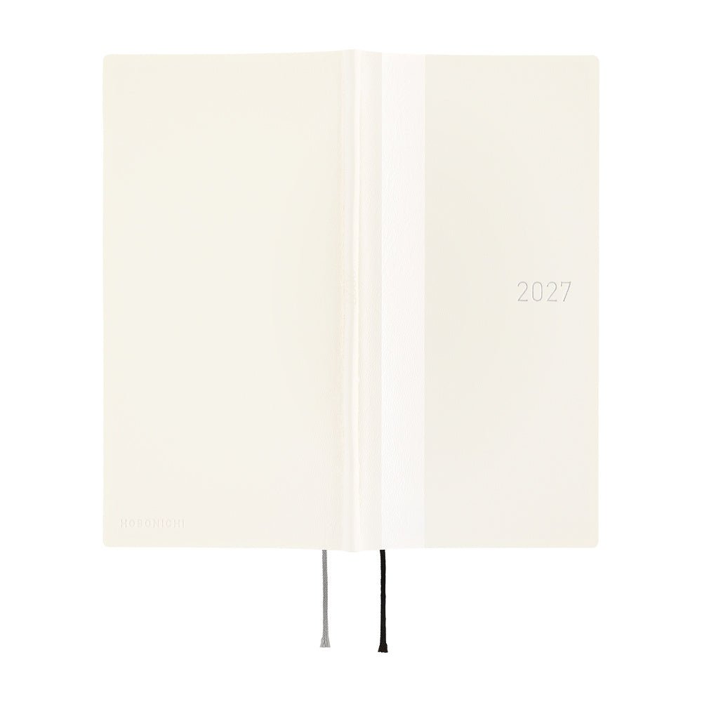 An off-white planner or notebook shown open, with a vertical spine, a white band, the year '2027' printed on the right side, and two ribbon bookmarks hanging from the bottom.